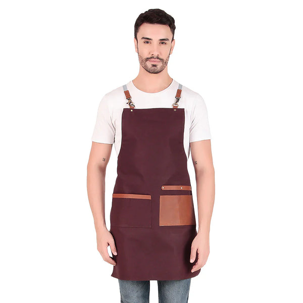 Man wearing a maroon apron with brown accents on a white background