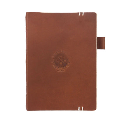 Brown leather notebook with a visible brand logo on a white background