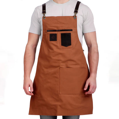 Brown apron with black accents worn by a person on a white background