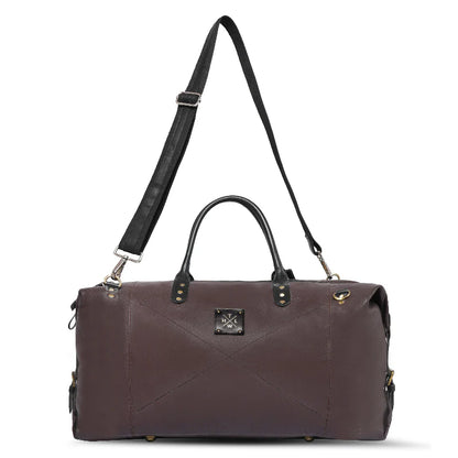 Brown leather duffel bag with black strap on a white background