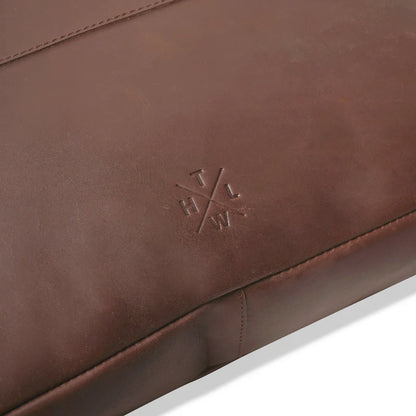 Brown leather product with a logo on a white background