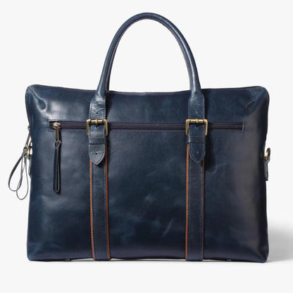 Blue leather bag with gold accents on a white background