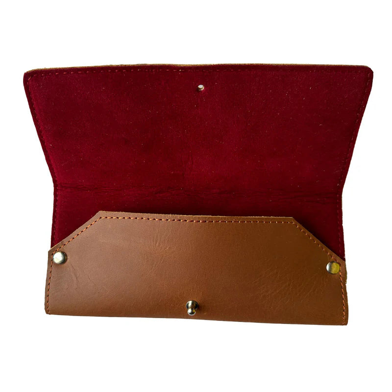 Red and brown leather wallet on a white background