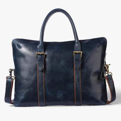 Blue leather bag with gold hardware on a white background