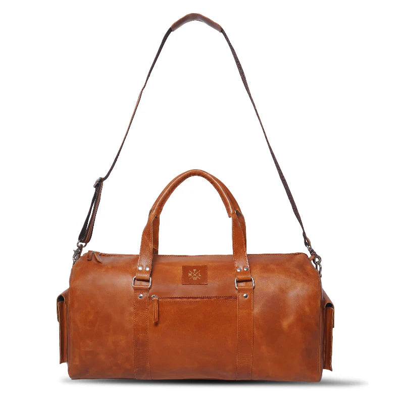Brown leather duffel bag with a strap on a white background