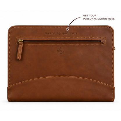 Personalized brown leather portfolio folder featuring custom name embossing above the front zipper pocket