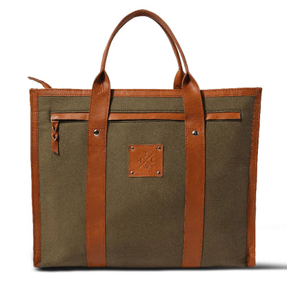Brown tote bag with leather straps on a white background