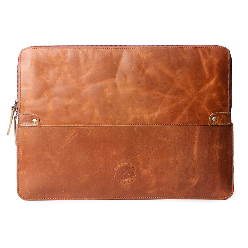 Brown leather laptop sleeve with visible branding on a white background