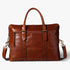 Brown leather bag with a shoulder strap on a light gray background