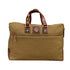 Brown canvas bag with leather handles and trim on a white background
