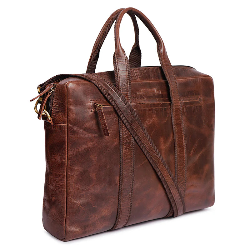 Brown leather briefcase with shoulder strap on a white background