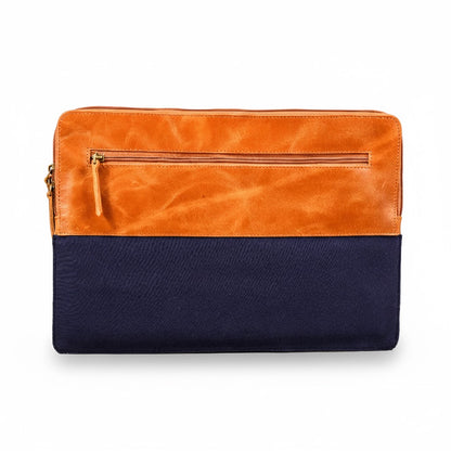 Two-toned orange and navy clutch bag on a white background