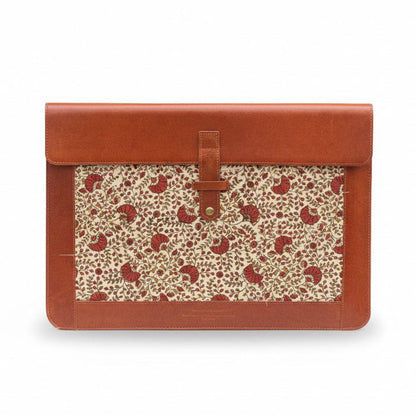 Brown leather clutch with floral pattern on a white background