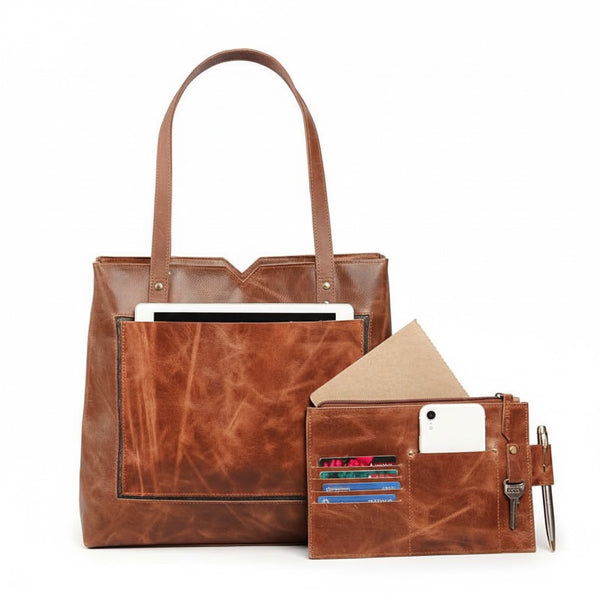 Brown leather tote bag with a smaller pouch on a white background