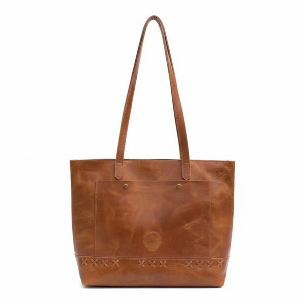 Brown leather tote bag on a white background