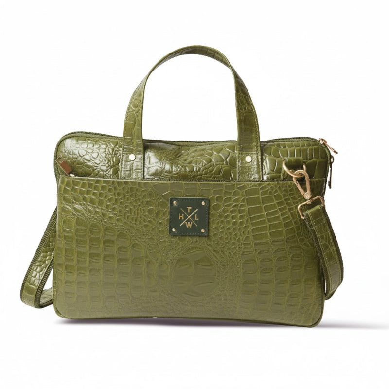 Green crocodile-patterned handbag with a visible brand logo on a white background