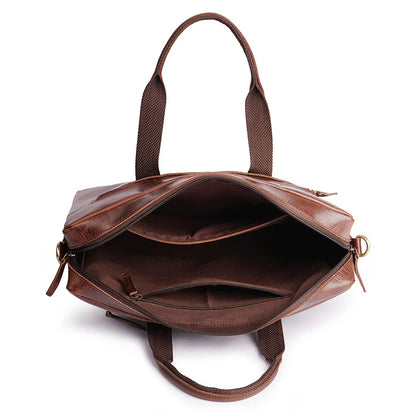 Brown leather handbag with open front pocket on a white background