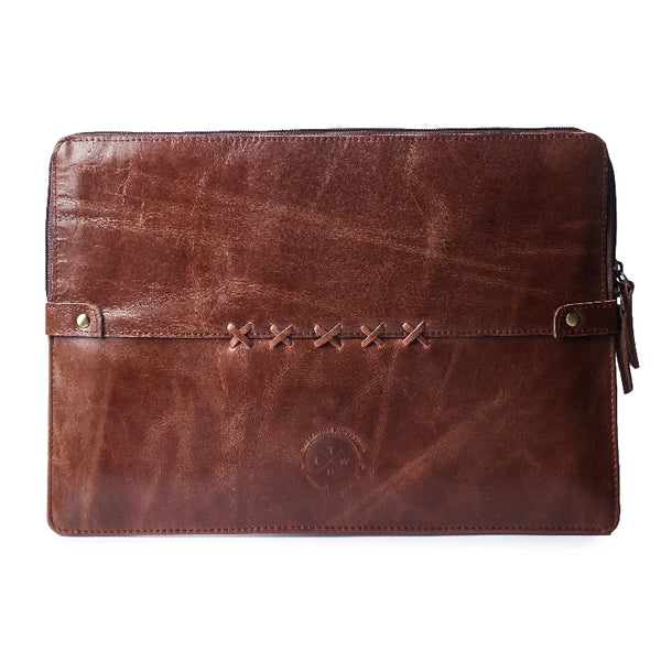 Brown leather clutch bag with stitching details on a white background